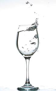 Water sloshing in a wine glass.